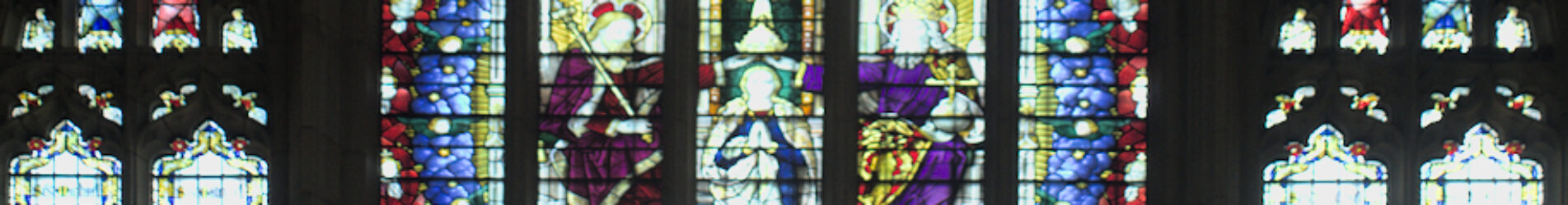 A stained glass window depicting the coronation of the Blessed Virgin Mary